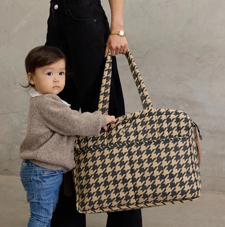 Polyester Portable Baby Hanging Stroller Organizer Diaper Tote Bag - Houndstooth diaper tote hand-carry with child partly overlapping upper-left bag